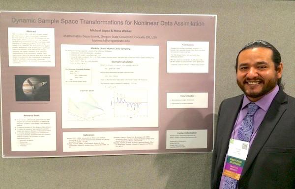 Micheal Lopez next to research poster