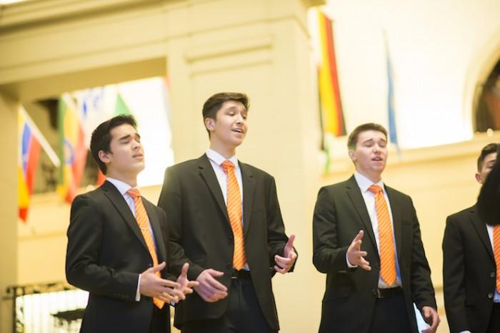 group of male choir singers performing in Memorial Union