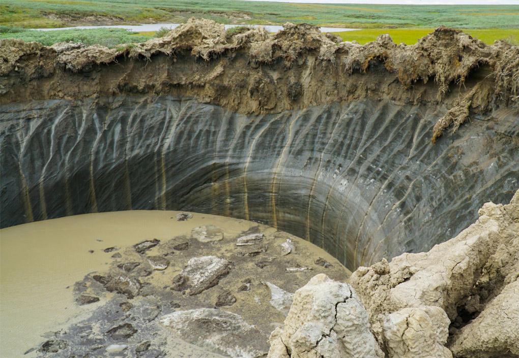 A bisection of earth shows a deep layer of permafrost below the regular soil in Russia.