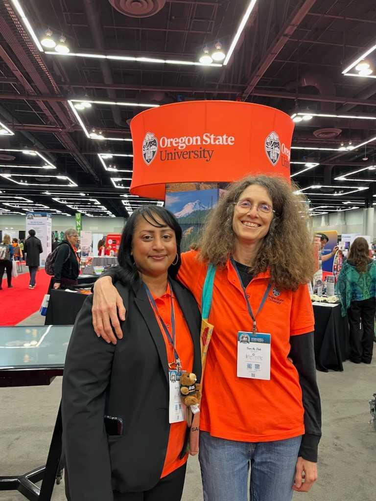 Associate Chemistry Professor Marilyn Mackiewicz (left) and Chemistry Professor May Nyman (right) posing for a photo before connecting with students.