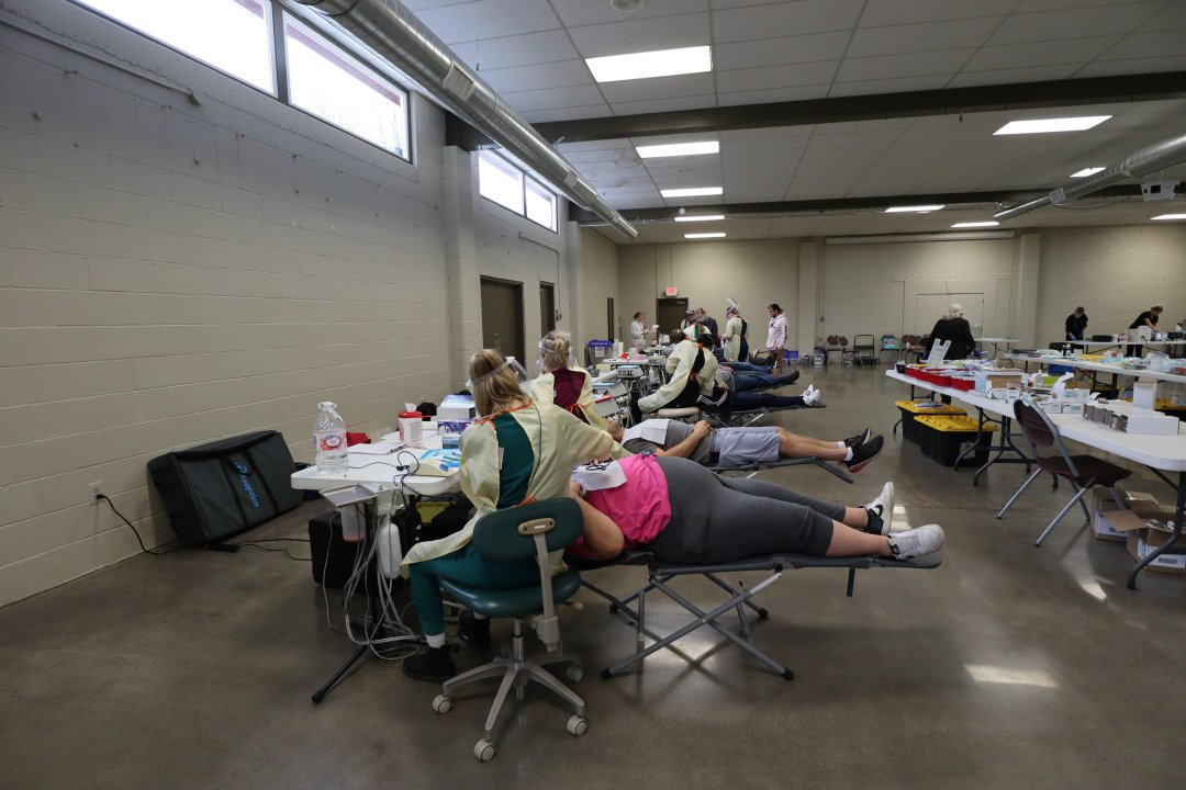 Patients receive dental care during the free dental clinic.