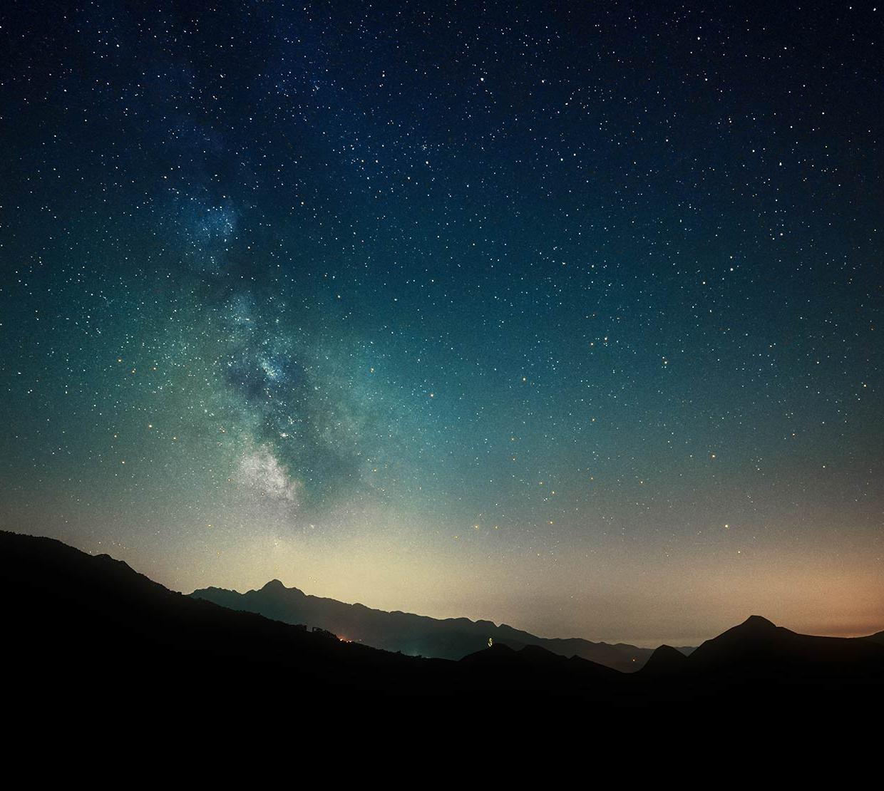 Starry time-lapse over mountain range