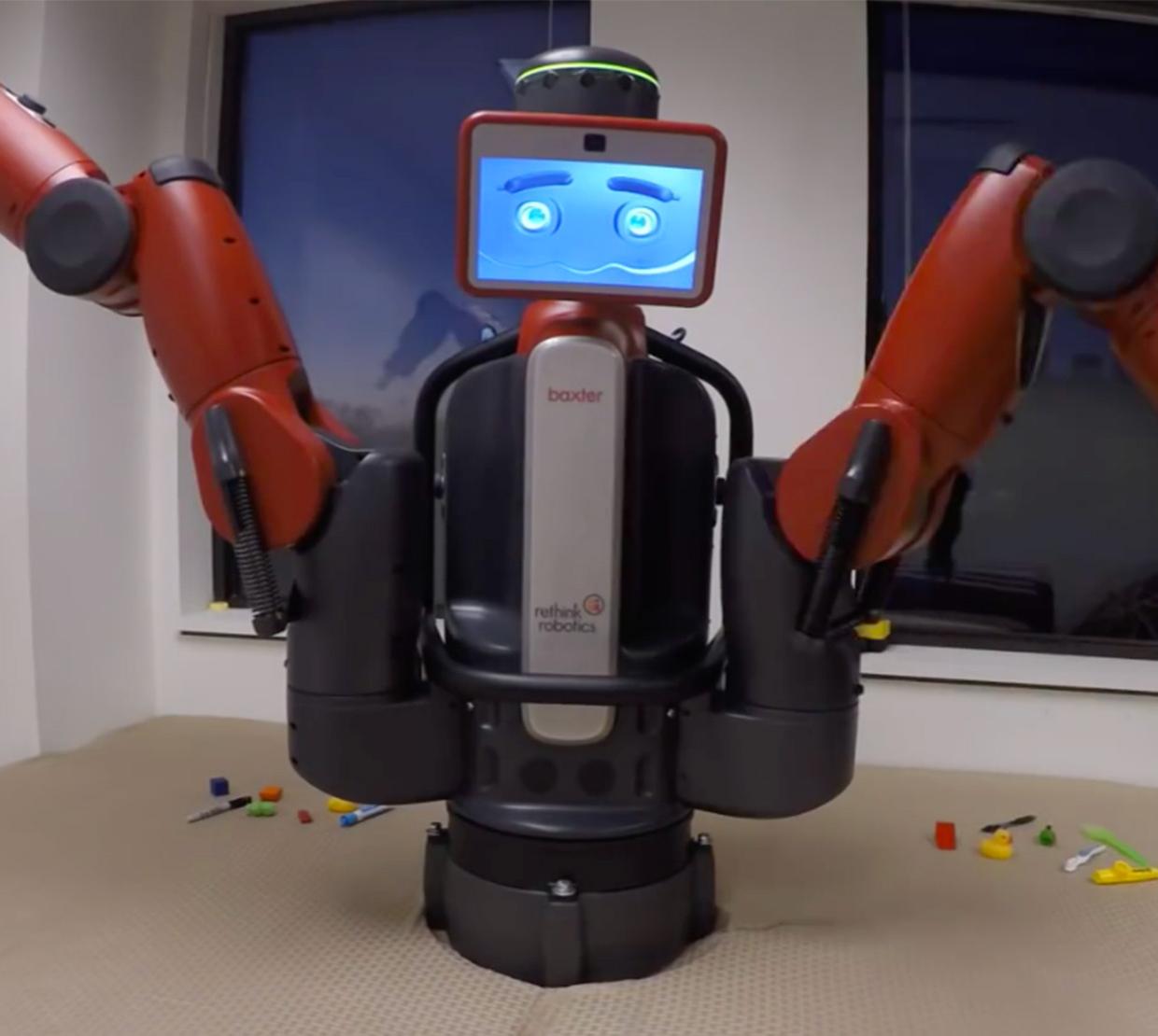 Robot with long arms sitting on office table