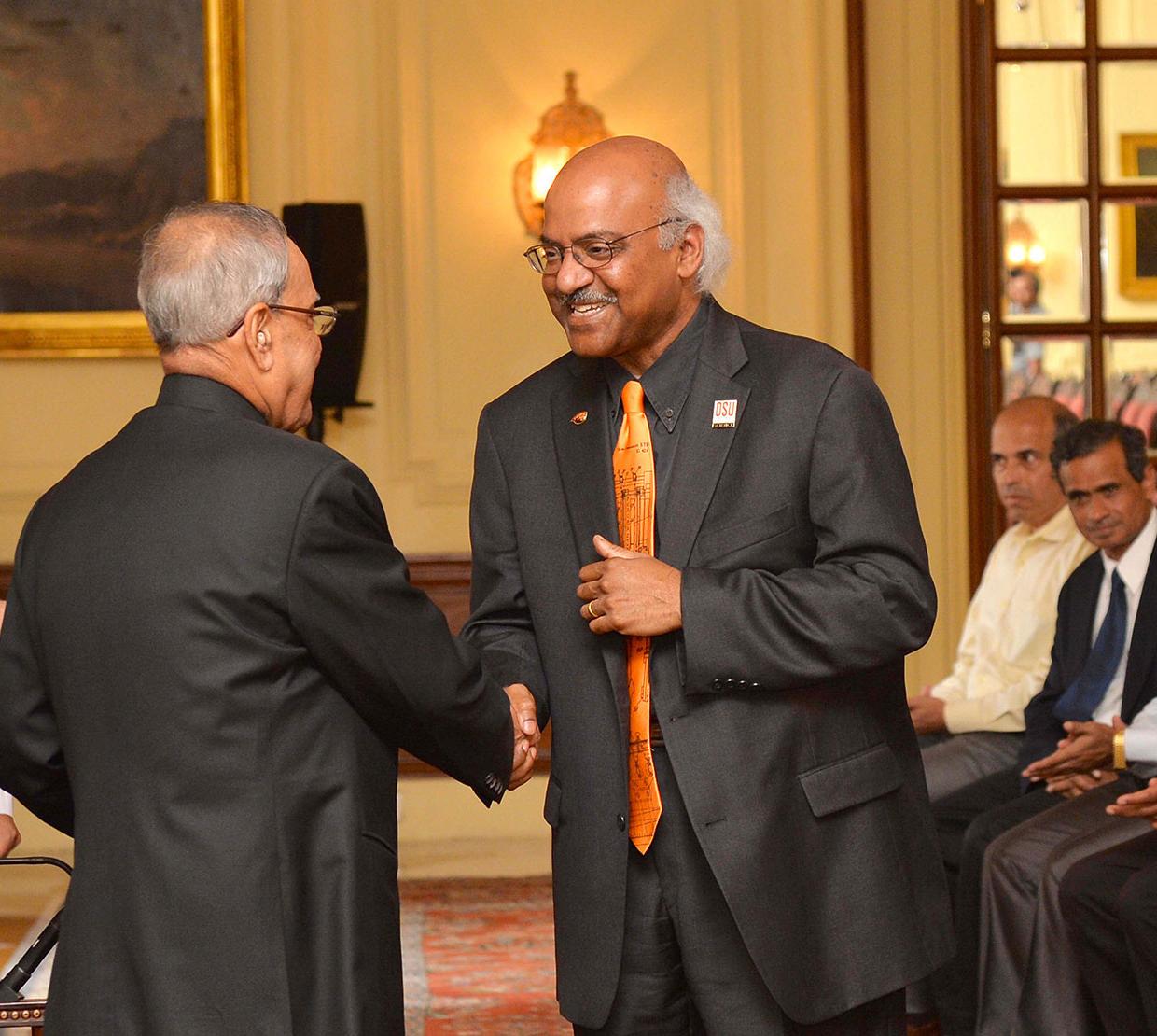 Sastry Pantula shaking hands with Mukherjee president