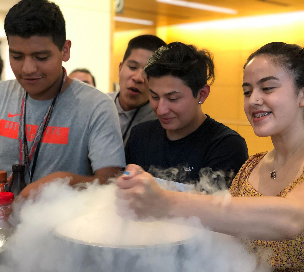 Juntos students experimenting with gas