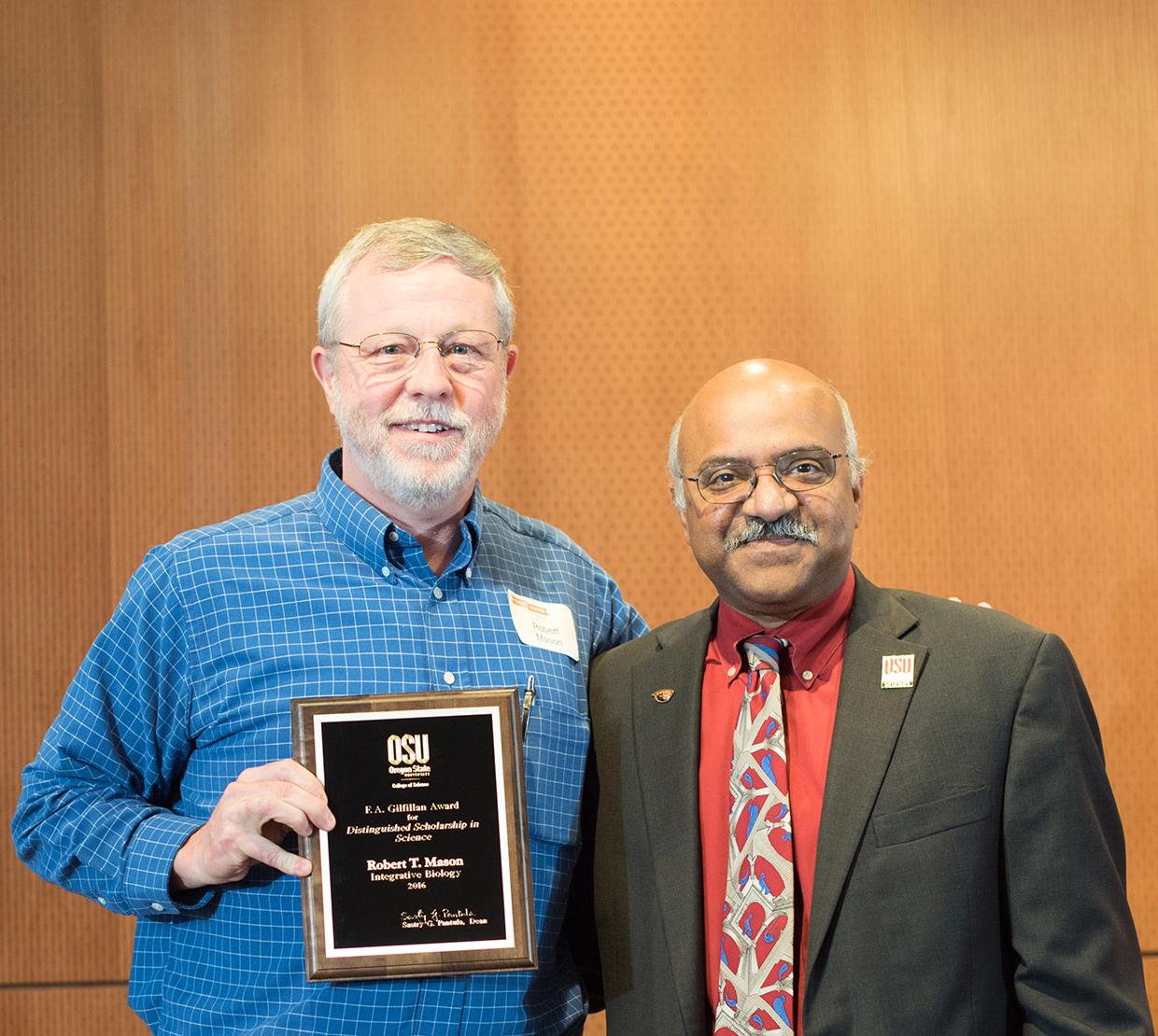 Robert T. Mason receiving award from Sastry Pantula