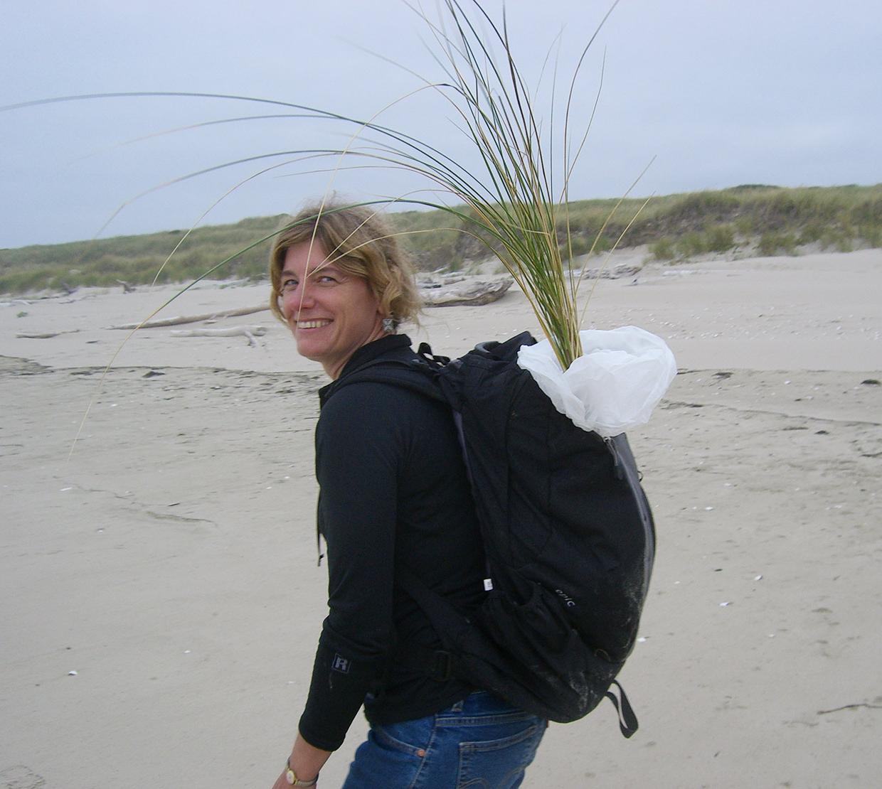 Sally D. Hacker walking though sand dune