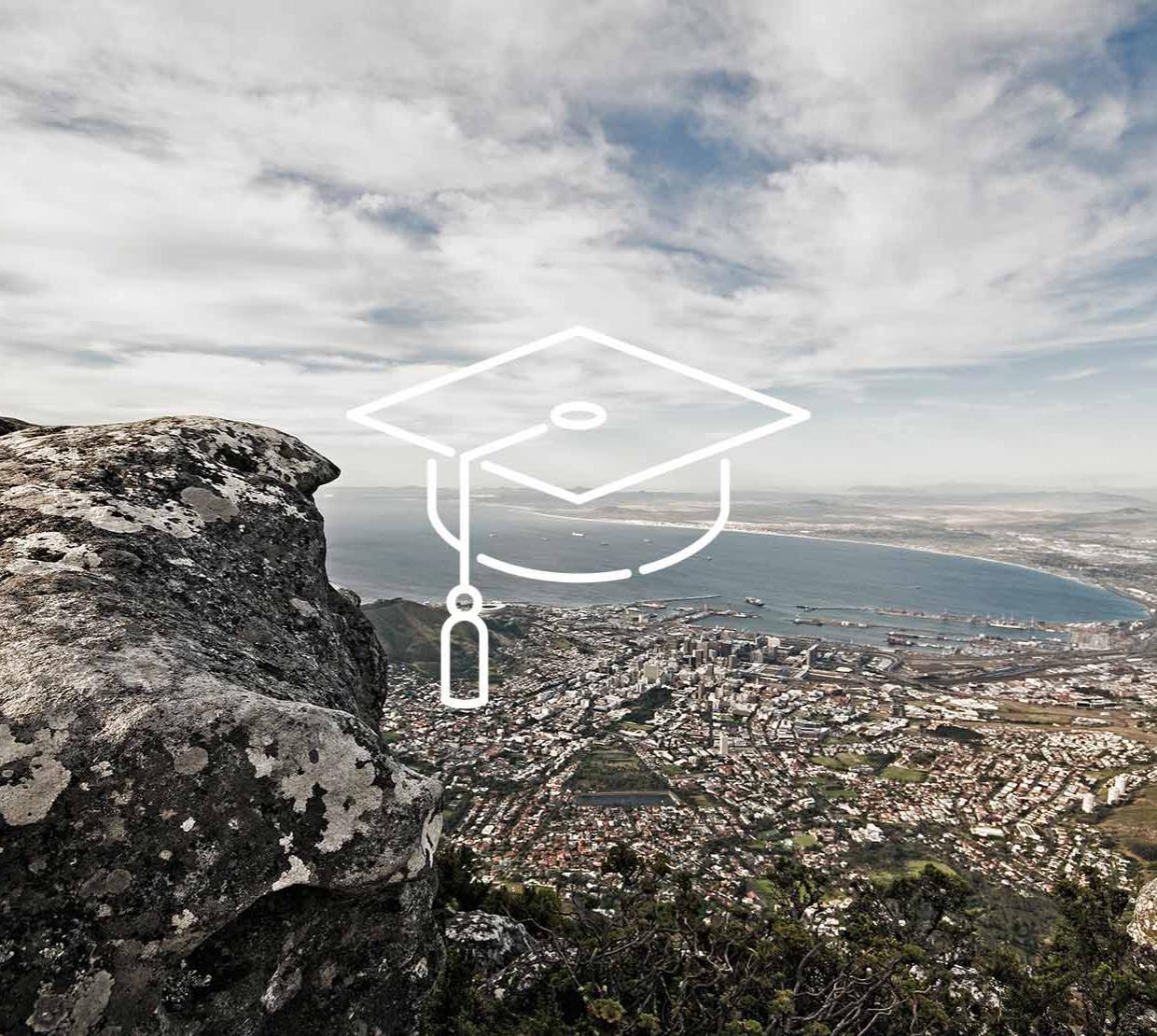 Graduation cap icon above South Africa coastal city