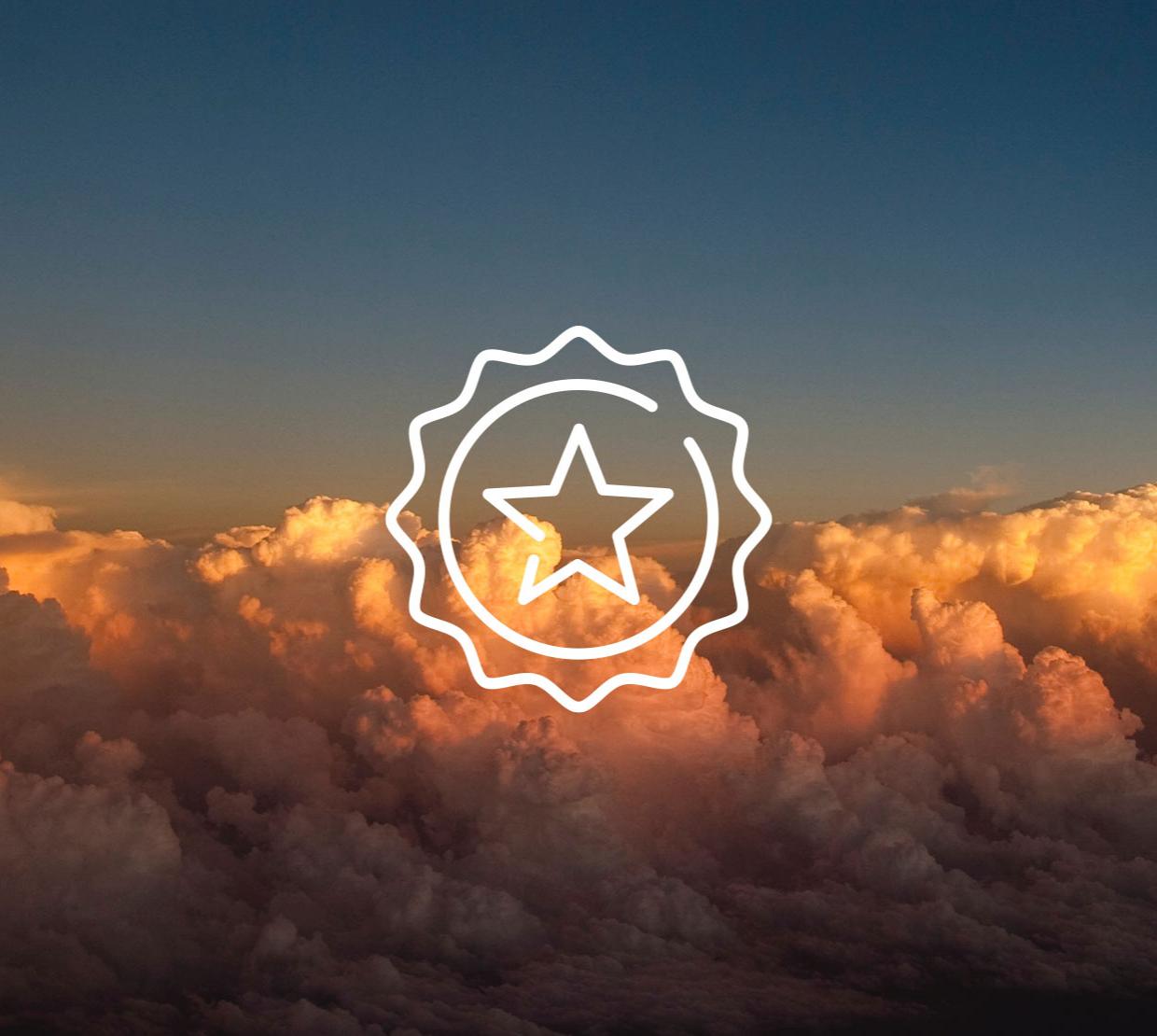 star icon above image of clouds at sunset