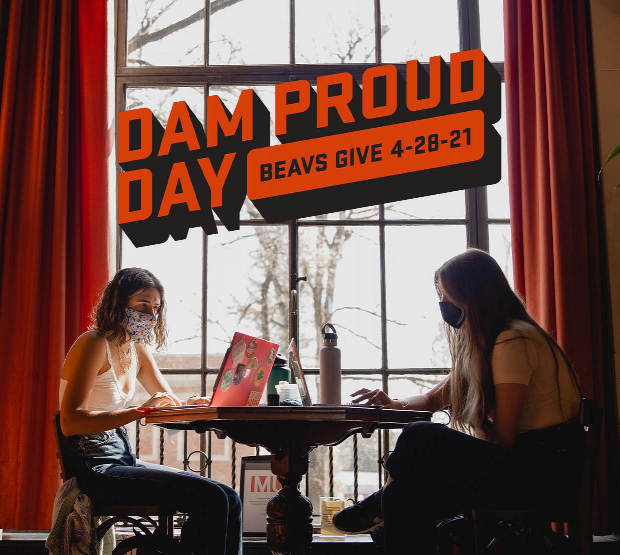 Dam Proud Day logo above an image of two students studying in the Memorial Union lounge.