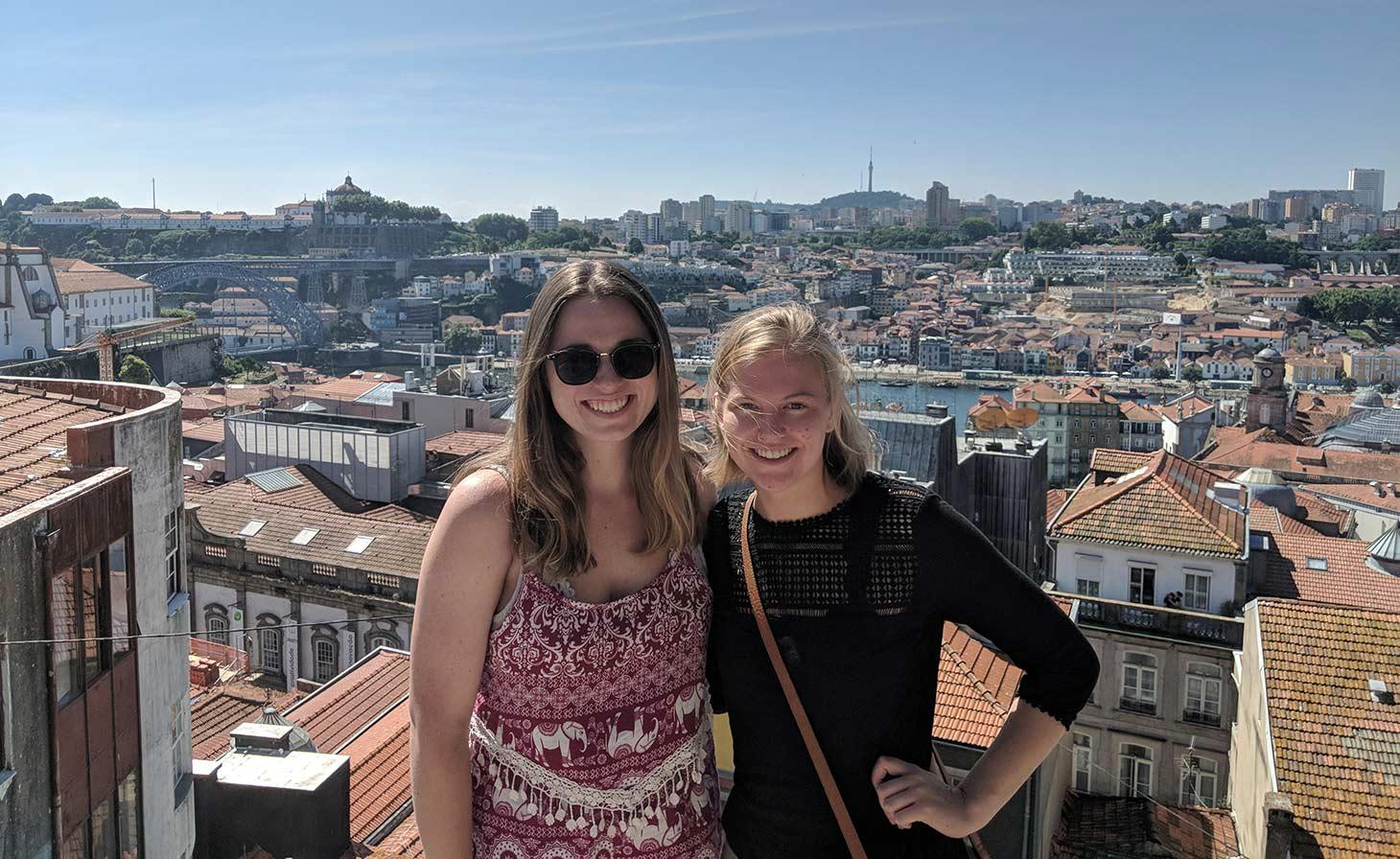 Julianna Donohoe with colleague in front of Spanish cityscape