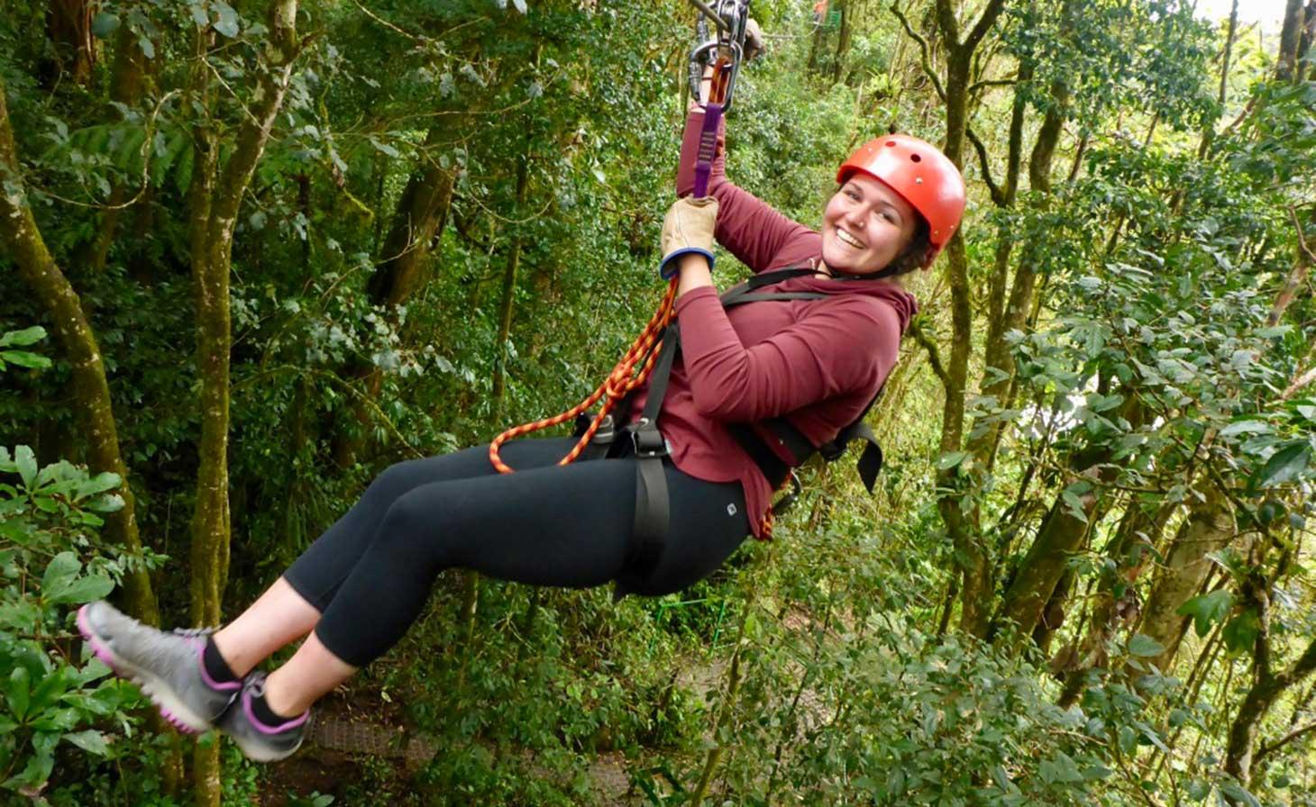 Rachel Ann Blood zip lining through tropical rainforest