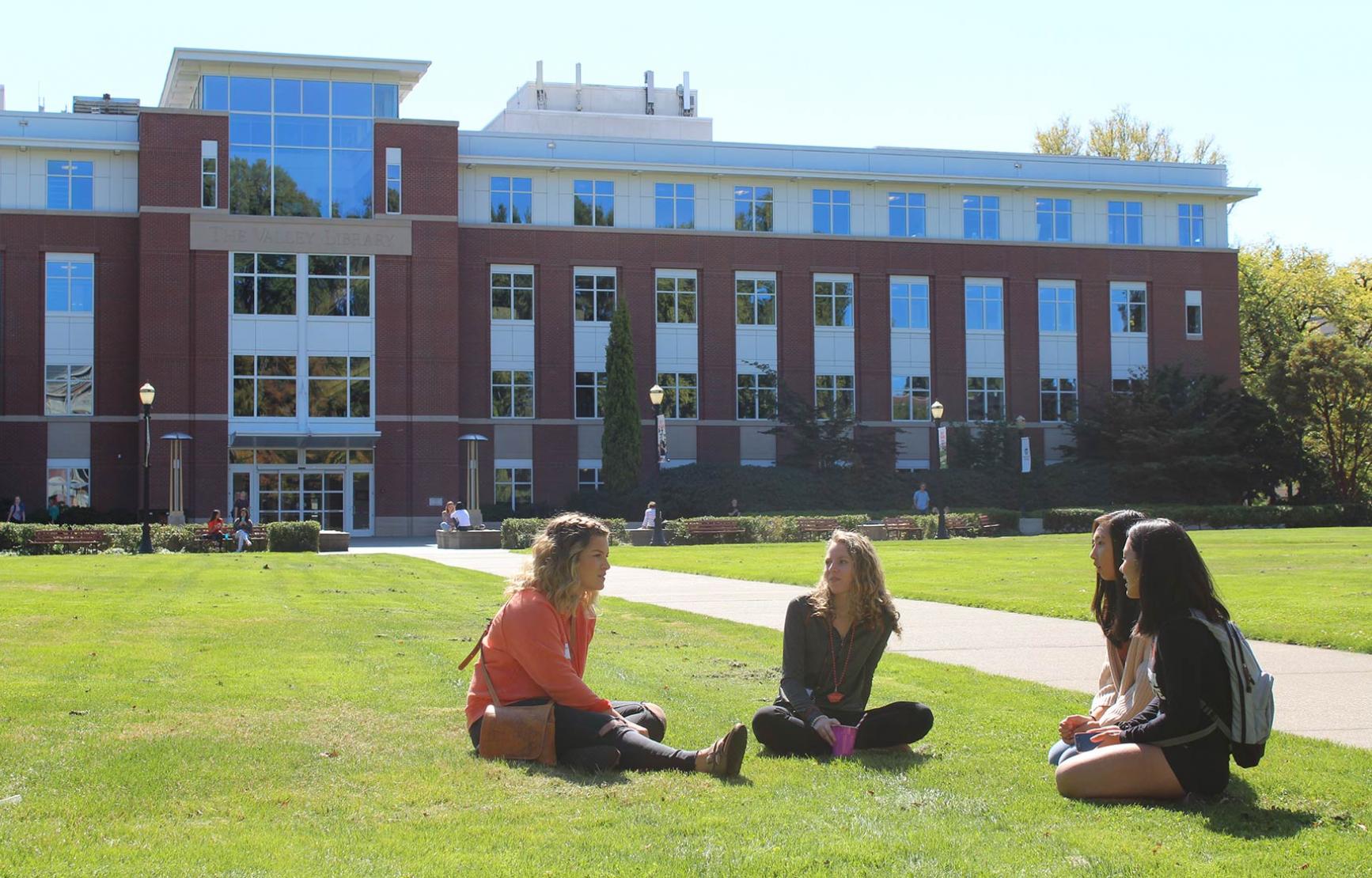 Students sitting on Valley Library lawn