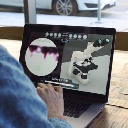 student using 3d virtual microscope o their laptop in coffee shop