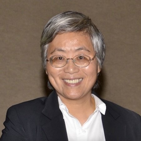 Photo of Dr. Annie Qu: Woman with short hair and glasses, smiling and wearing white collared shirt and blazer.