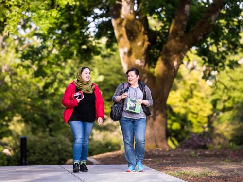 Two students walking on OSU Corvallis campus.