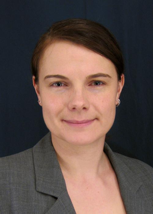 Sandra Loesgen in front of black backdrop