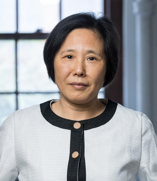Headshot of Wei Kong smiling lightly inside her Gilbert Hall lab