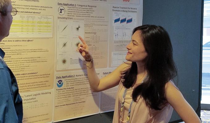 Heather H. Kitada talking about her research poster