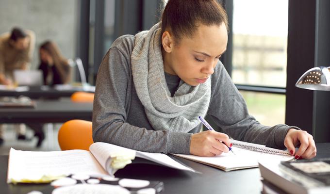 Woman working on homework at table