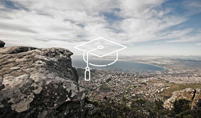 Graduation cap icon above South Africa coastal city