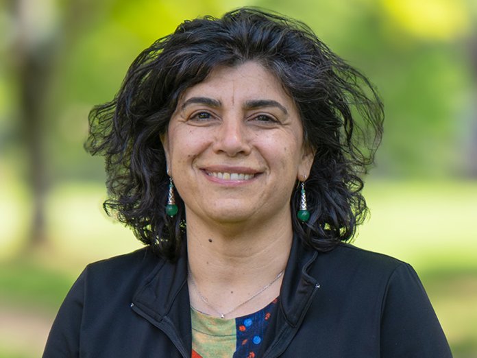 Smiling woman with a colorful shirt