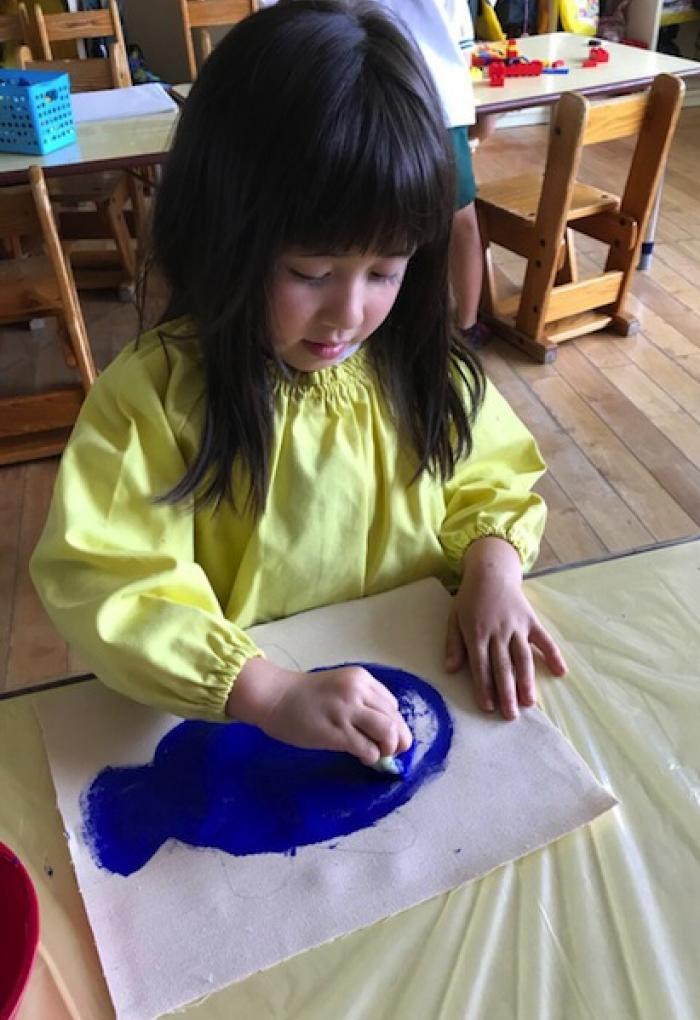 Child in soma drawing with YInMn Blue
