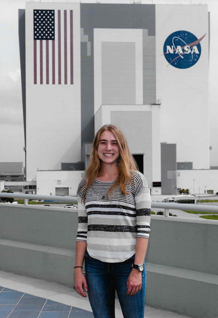 Jessica Scotten standing in front of NASA facility