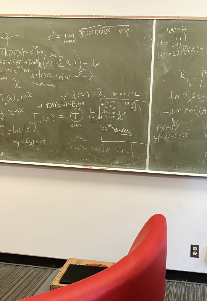 Mathematics equations on a blackboard.