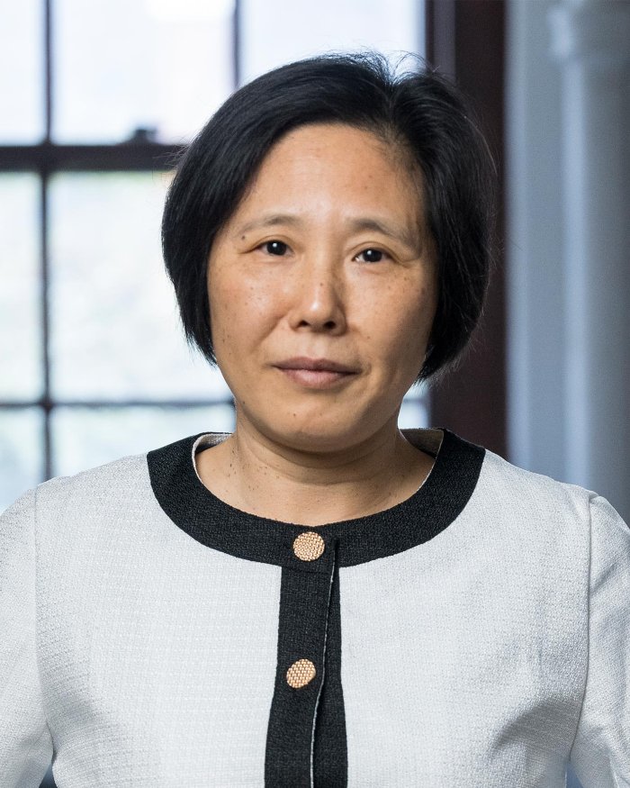 Headshot of Wei Kong smiling lightly inside her Gilbert Hall lab