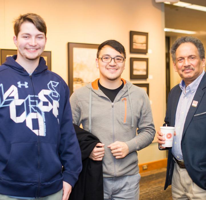 Mas Subramanian with students in lobby