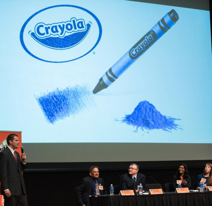 Smith Holland speaking with Crayola crayon slide