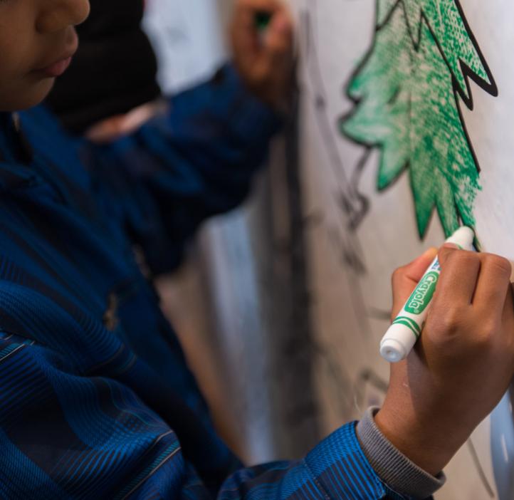 children coloring Crayola paper banner of trees