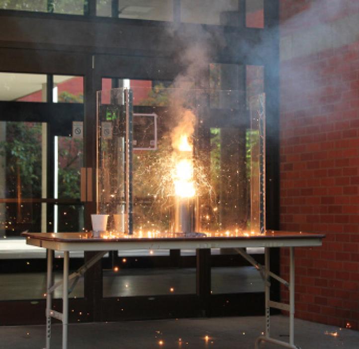 flaming chemistry experiment on table