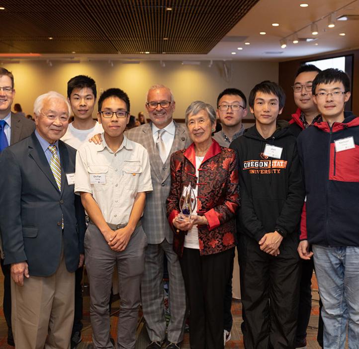 Edward and Janet Chen, and John Donnelly with students and staff