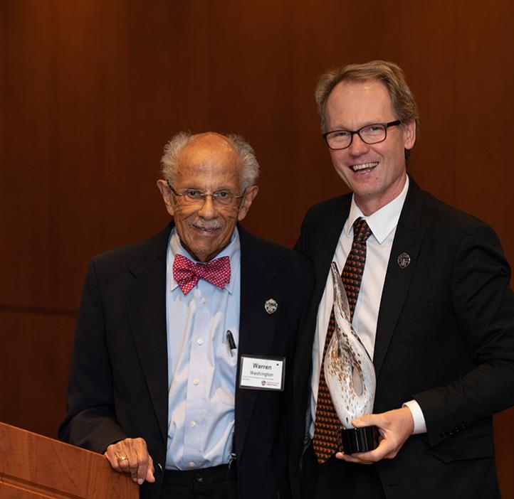 Warren Washington receiving award from Roy Haggerty