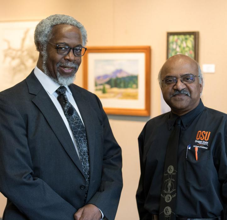Sylvester James “Jim” Gates, Jr. and Sastry Pantula standing next to artwork