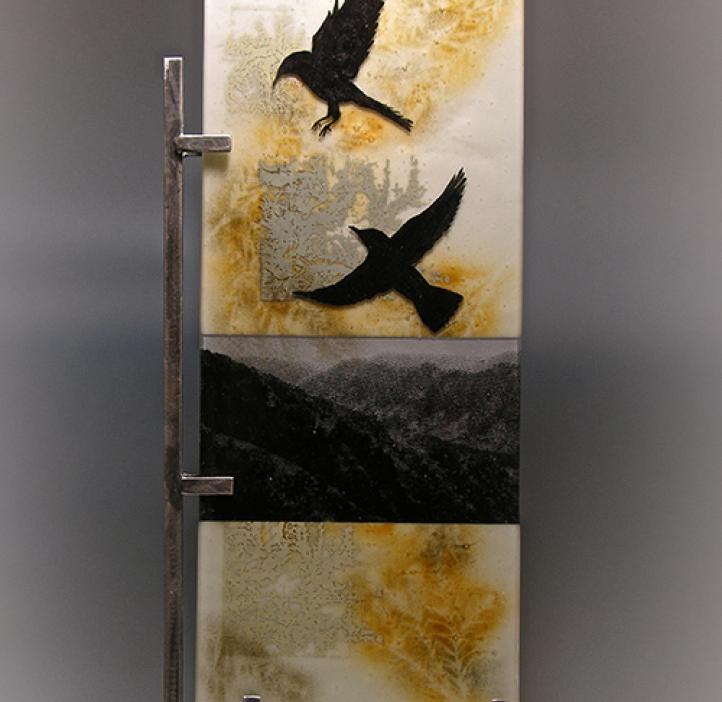 art piece depicting crows flying over mountains