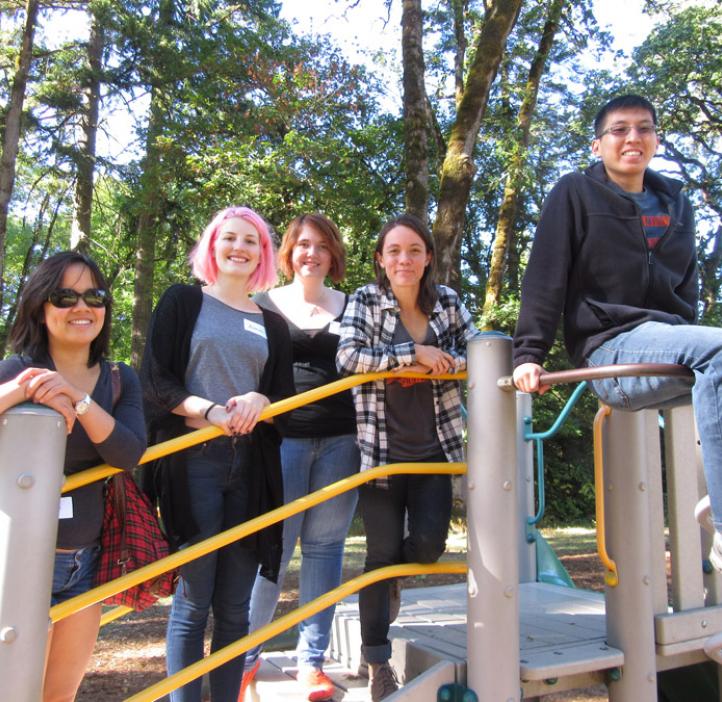 science students sitting on play structure