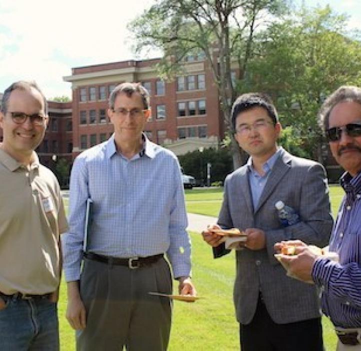 male science faculty standing in Valley Library field