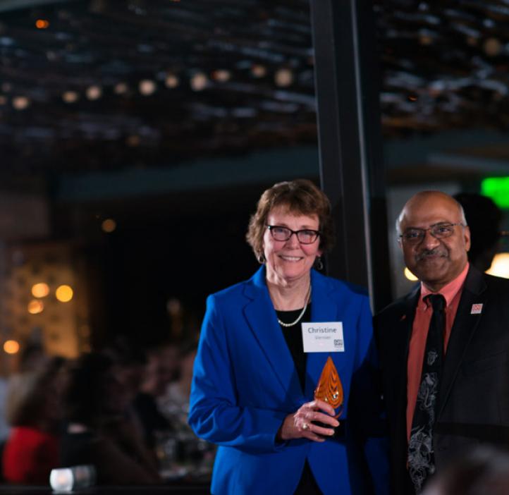 Christine Vernier, receiving Distinguished Service Award from Sastry Pantula