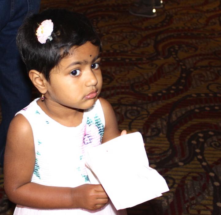 child holding napkins