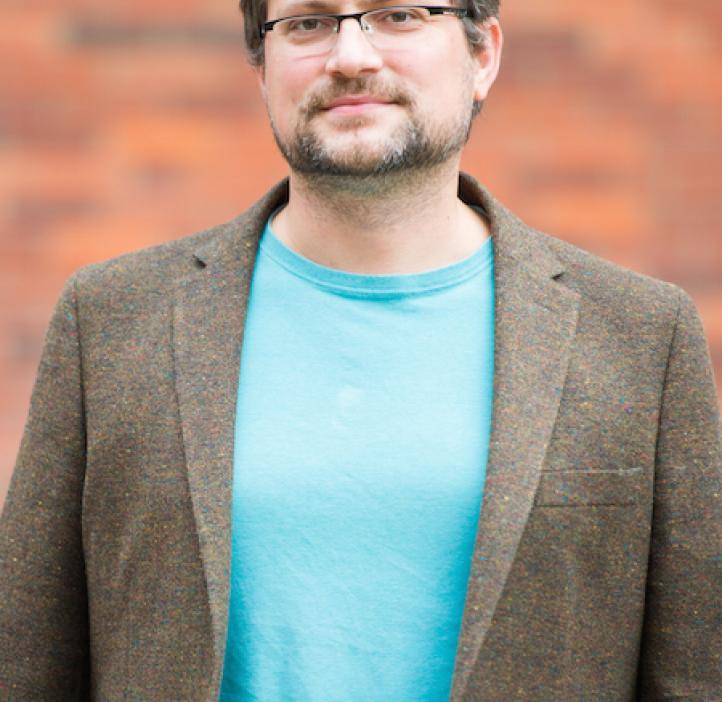 Radu Dascaliuc, Mathematics professor in front of brick backdrop