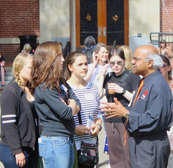 Sastry Pantula talking with female science students