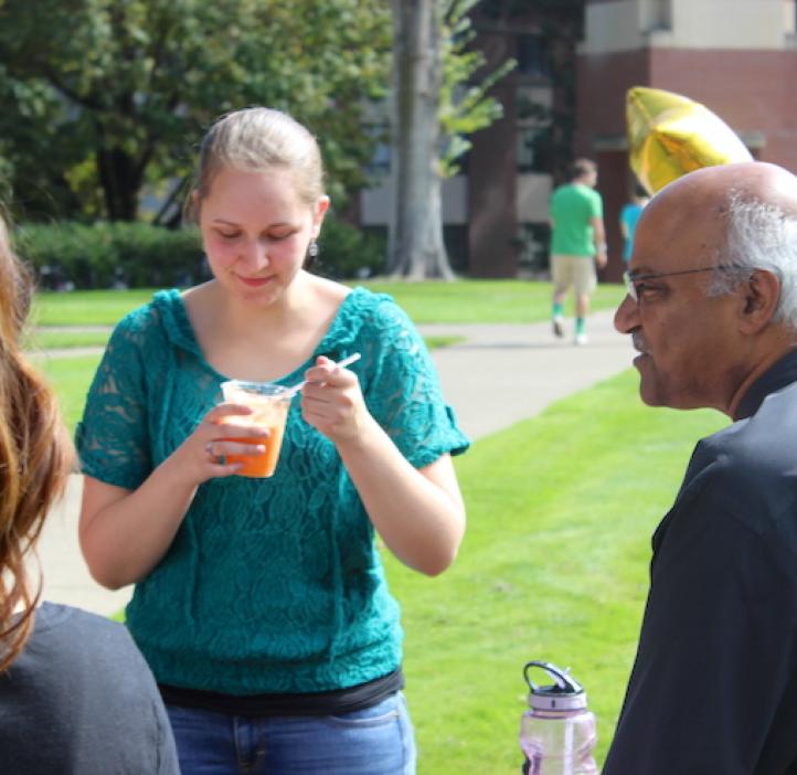 female science student enjoying ice cream float and talking with Sastry Pantula