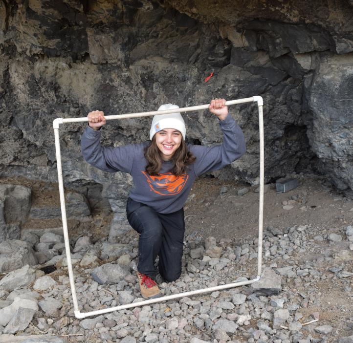 Manon Vezinet in an underground cave wearing an Oregon State University sweatshirt.