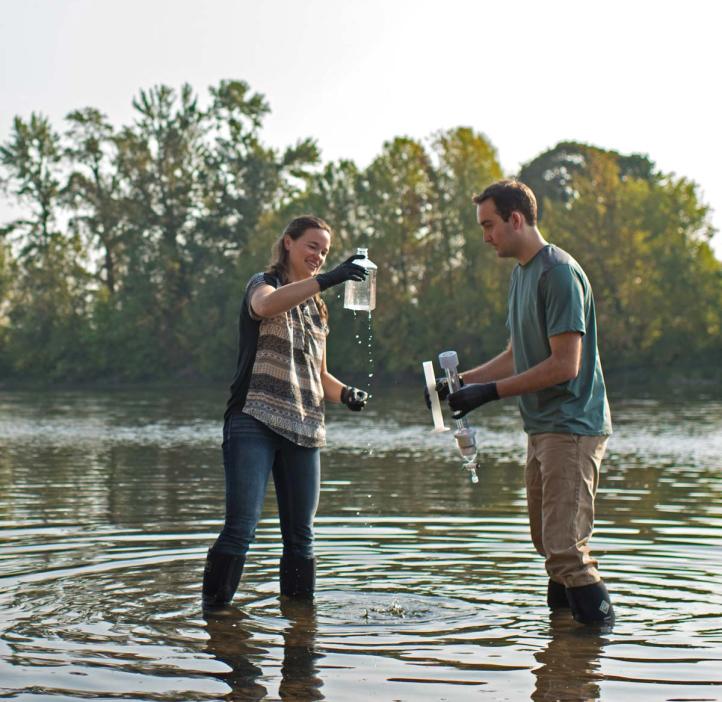 Students taking samples in a lake.