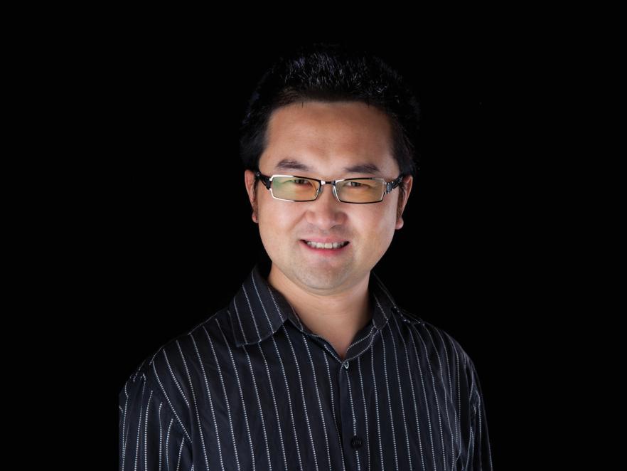 David Ji in front of black backdrop