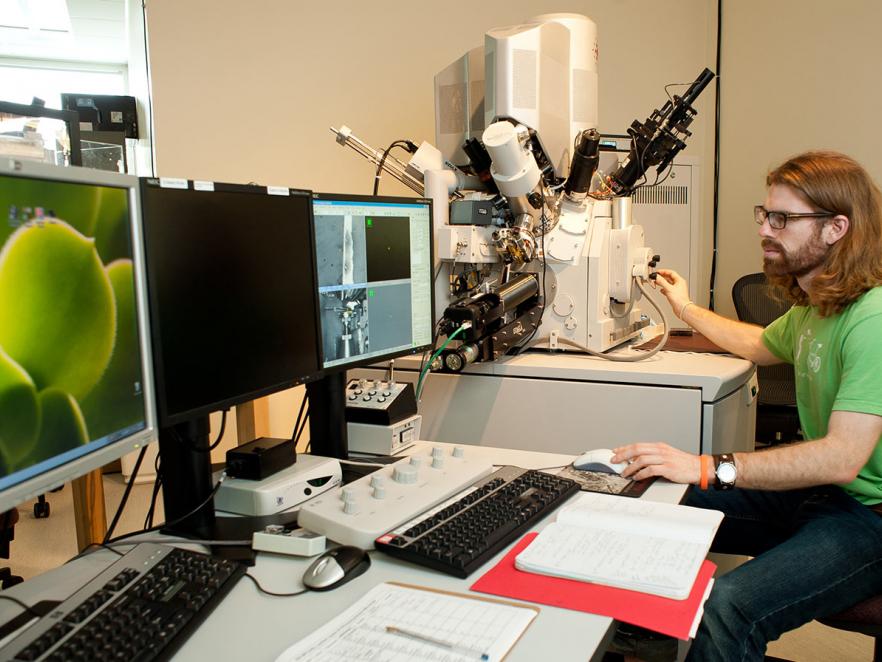 Student working on computers in Electron Microscope Facility.