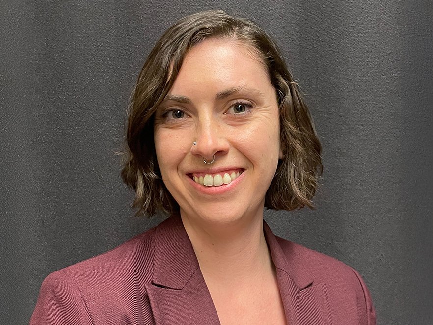 Alison smiles in a professional headshot